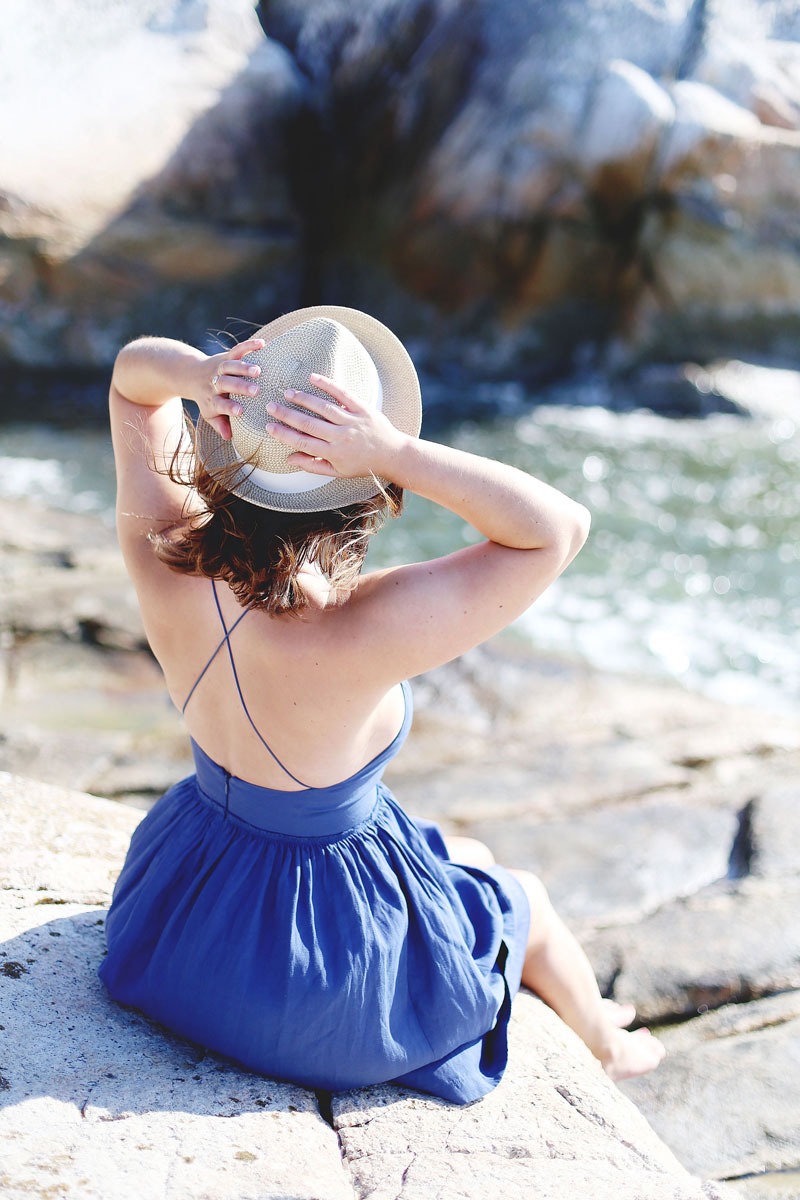 To Vogue or Bust wearing Wilfred by Aritzia dress and straw hat at Lighthouse Park, Vancouver, Canada