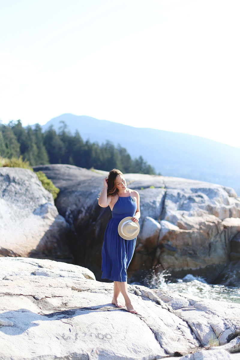 To Vogue or Bust wearing Wilfred by Aritzia dress and straw hat at Lighthouse Park, Vancouver, Canada