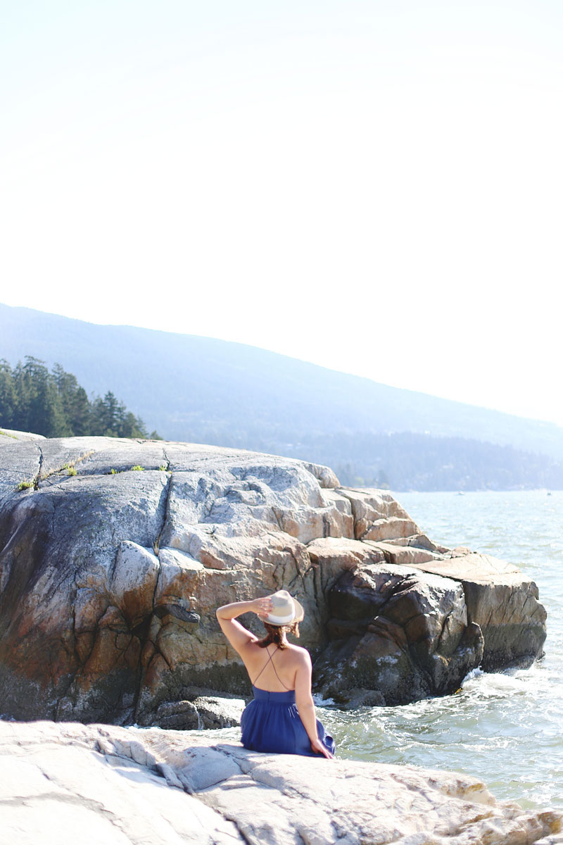 To Vogue or Bust wearing Wilfred by Aritzia dress and straw hat at Lighthouse Park, Vancouver, Canada