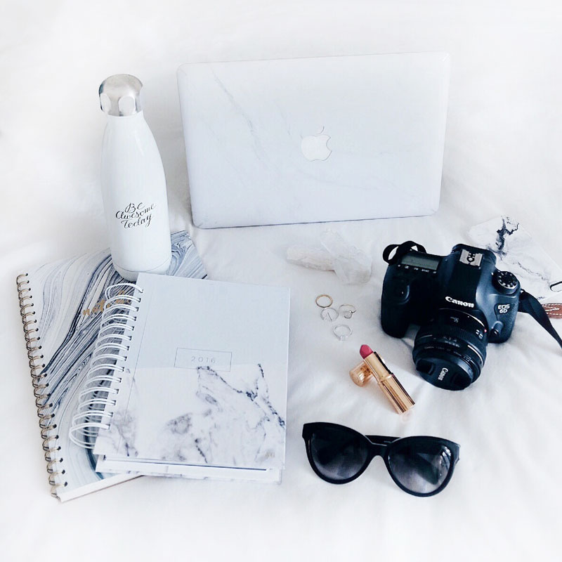 Marble MacBook laptop decal, marble notebook, Canon 6D camera, Charlotte Tilbury lipstick in Miranda May, Swell bottle and Leah Alexandra and Swarovski rings