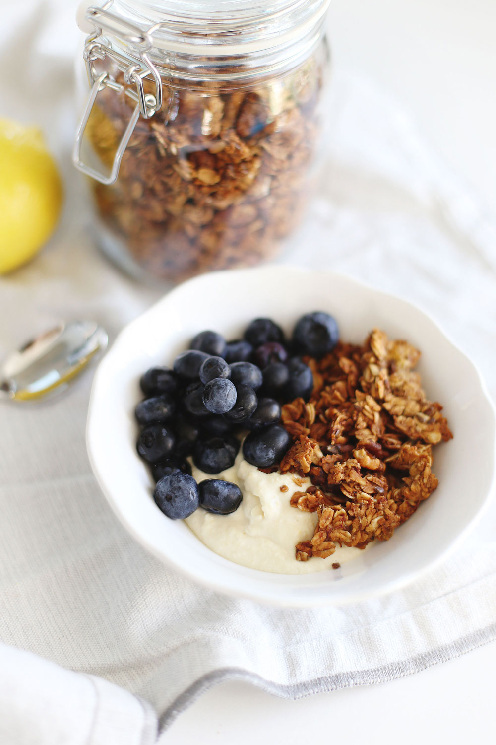 To Vogue or Bust overnight oats breakfast recipe with vegan lemon curd, vegan banana bread granola and blueberries.