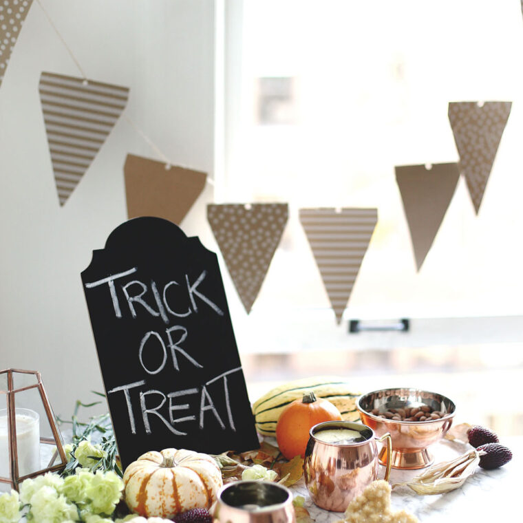 Halloween party hosting tips with Etsy products including copper cups, paper decorations and pumpkin styling