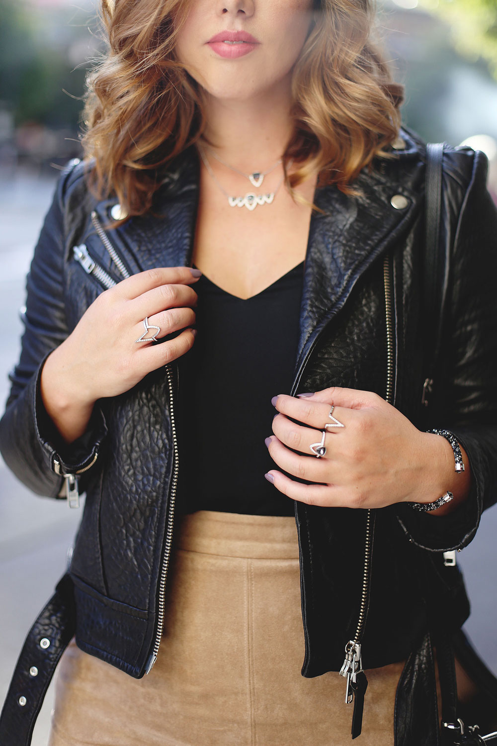 How to layer jewelry in Swarovski jewelry, Aritzia suede pencil skirt, Aritzia black camisole, Mackage leather jacket, Express black heels and Aritzia Wilfred fringe leather bag