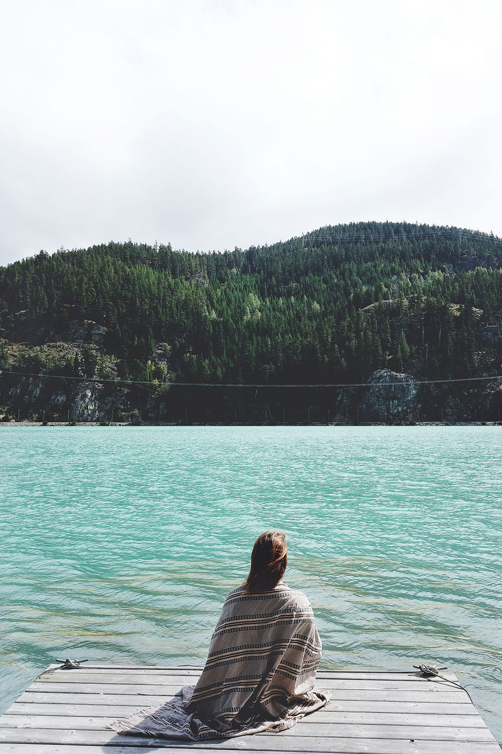 Most beautiful lakes in BC: To Vogue or Bust in an Aritzia blanket scarf at Green Lake in Whistler, Canada