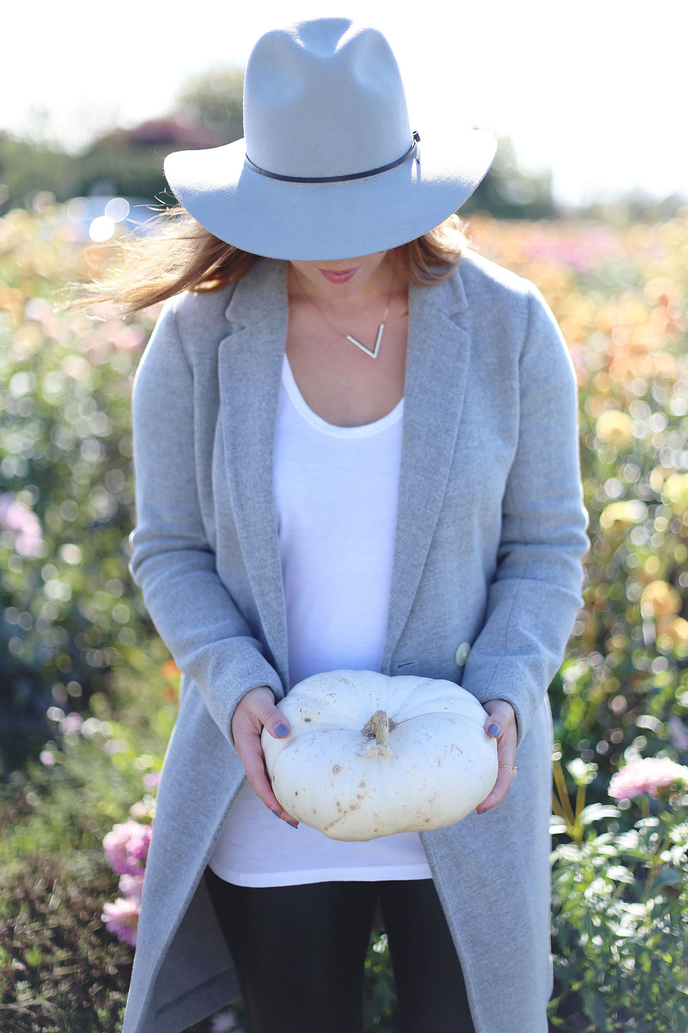 To Vogue or Bust shares details about the Tsawwassen Mills grand opening in the best pumpkin patch in Vancouver Backroads Family Market dressed in an Aritzia wool coat, Aritzia grey hat, Aritzia leather leggings, Aritzia T-shirt and taupe Tieks flats with Leah Alexandra Jewelry