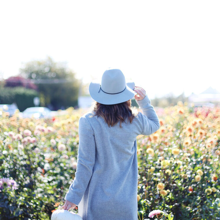 To Vogue or Bust shares details about the Tsawwassen Mills grand opening in the best pumpkin patch in Vancouver Backroads Family Market dressed in an Aritzia wool coat, Aritzia grey hat, Aritzia leather leggings, Aritzia T-shirt and taupe Tieks flats with Leah Alexandra Jewelry