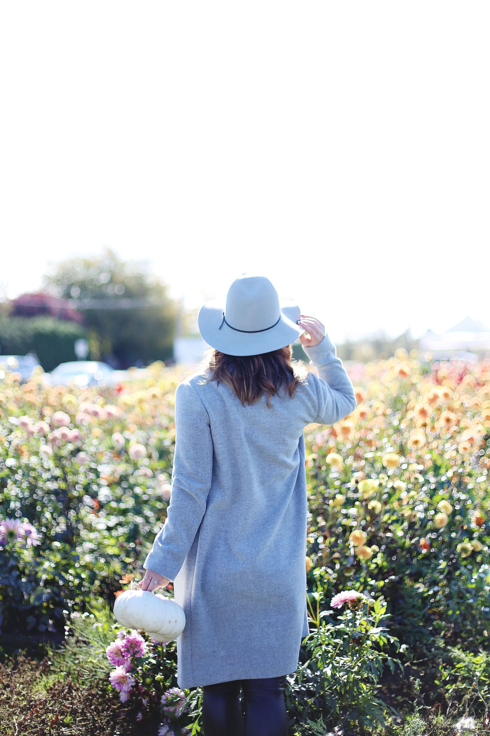 To Vogue or Bust shares details about the Tsawwassen Mills grand opening in the best pumpkin patch in Vancouver Backroads Family Market dressed in an Aritzia wool coat, Aritzia grey hat, Aritzia leather leggings, Aritzia T-shirt and taupe Tieks flats with Leah Alexandra Jewelry