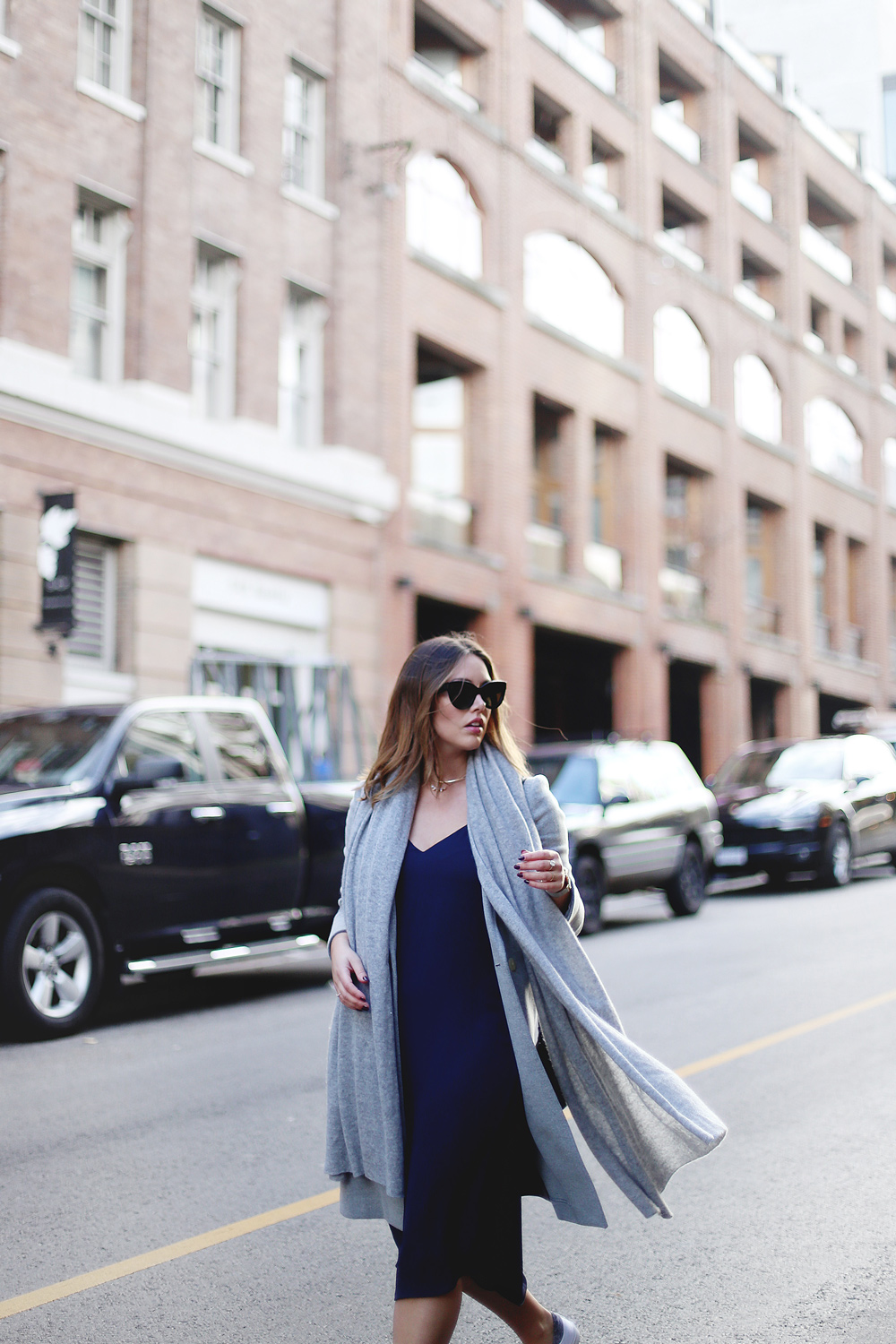 How to wear Converse sneakers with a dress in an Aritzia dress, White + Warren cashmere travel wrap, Converse white sneakers, Celine sunglasses styled by To Vogue or Bust