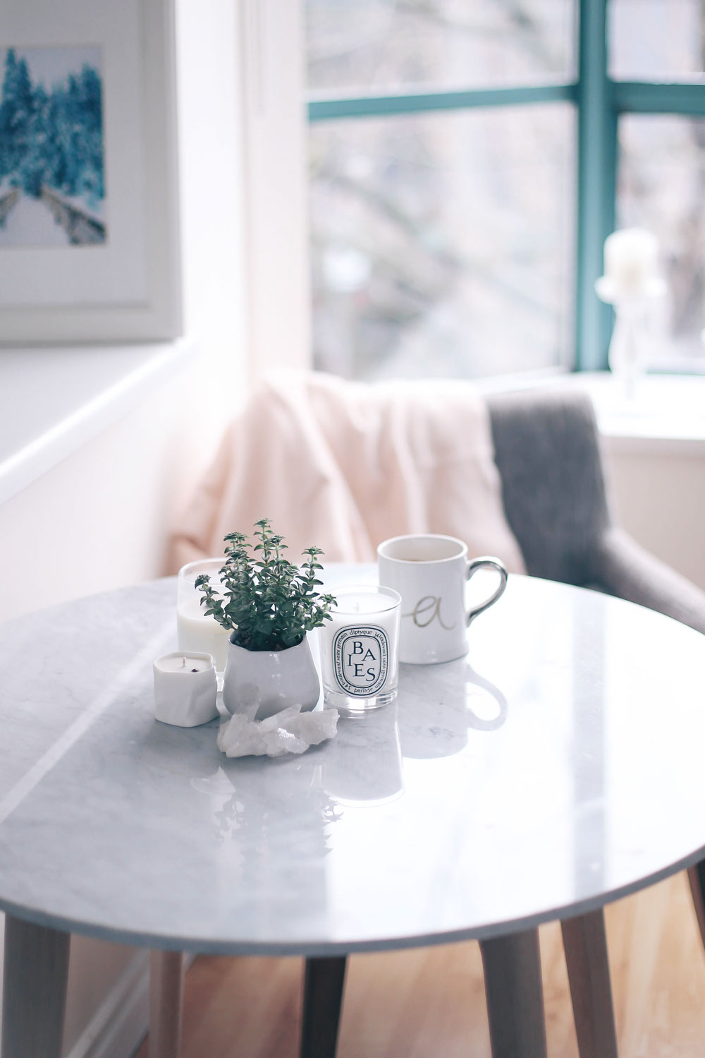 How to decorate small apartments for the holidays with Article Mara marble table, Chanel grey chairs