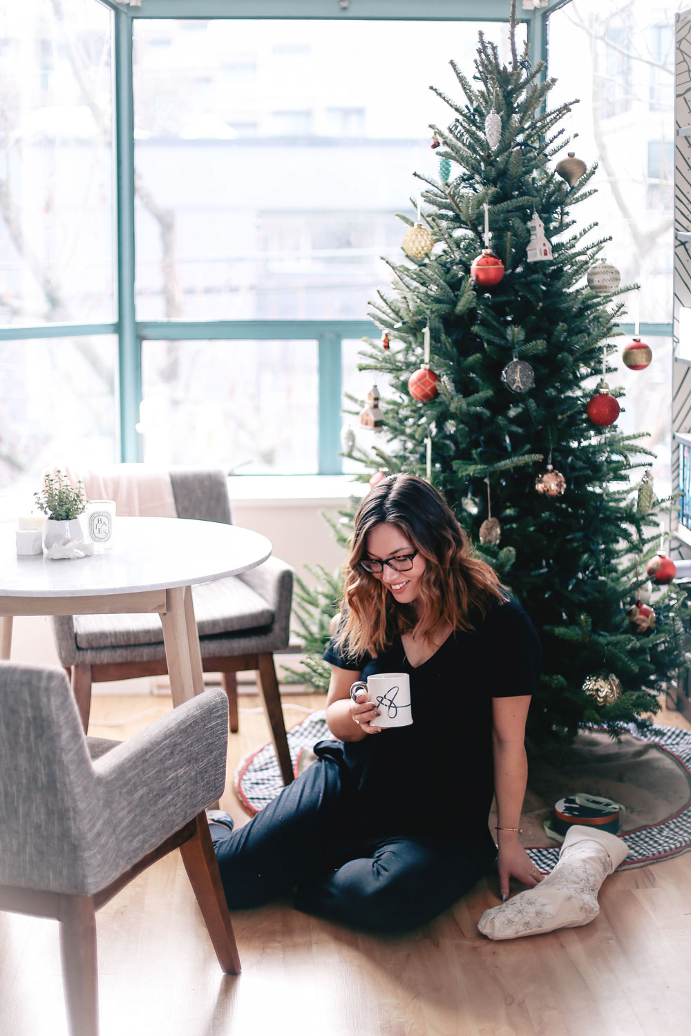 How to decorate small apartments for the holidays with Article Mara marble table, Chanel grey chairs