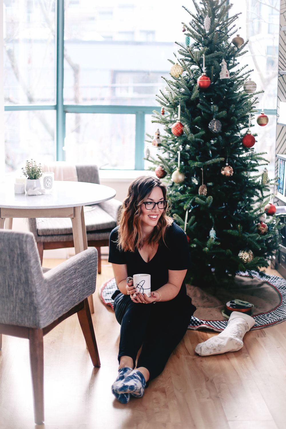 How to decorate small apartments for the holidays with Article Mara marble table, Chanel grey chairs