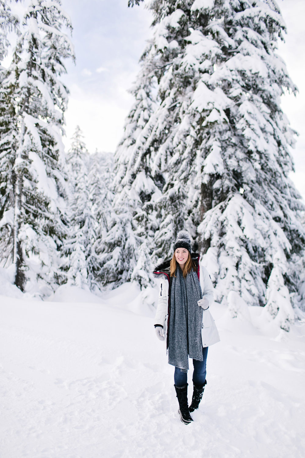 What to wear in the snow in Vancouver, with Noize parka, Express pom pom beanie, Sorel boots, White and Warren cashmere travel wrap and Aritzia mittens styled by To Vogue or Bust