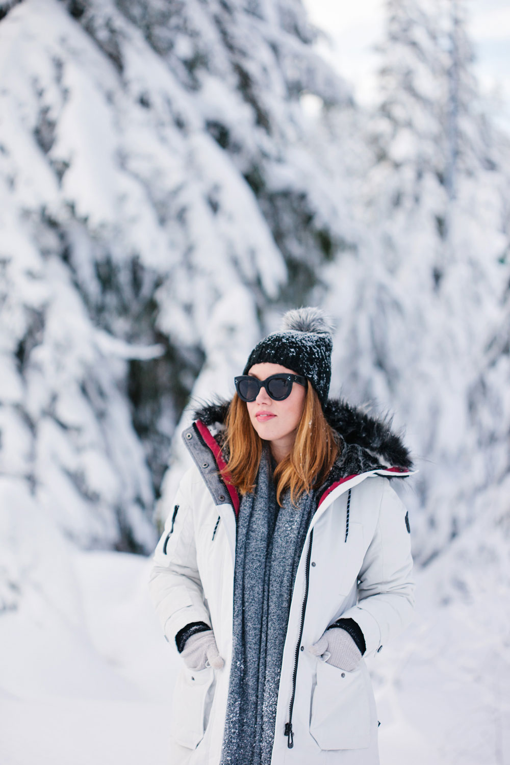 What to wear in the snow in Vancouver, with Noize parka, Express pom pom beanie, Sorel boots, White and Warren cashmere travel wrap and Aritzia mittens styled by To Vogue or Bust