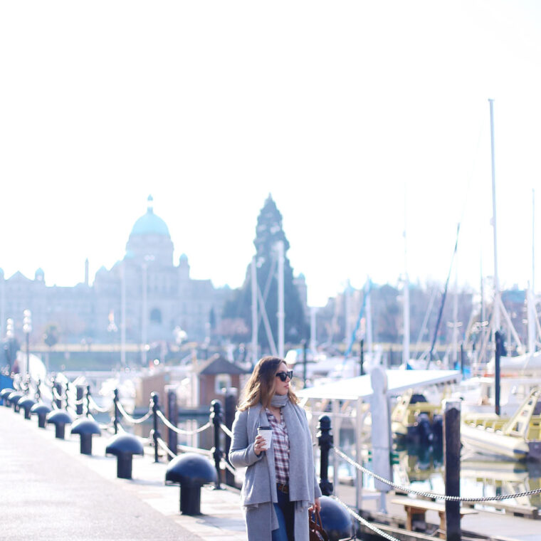 Plaid shirt styling tips in a grey wool coat, grey cashmere scarf, ripped skinny jeans, leather ankle boots and red plaid shirt