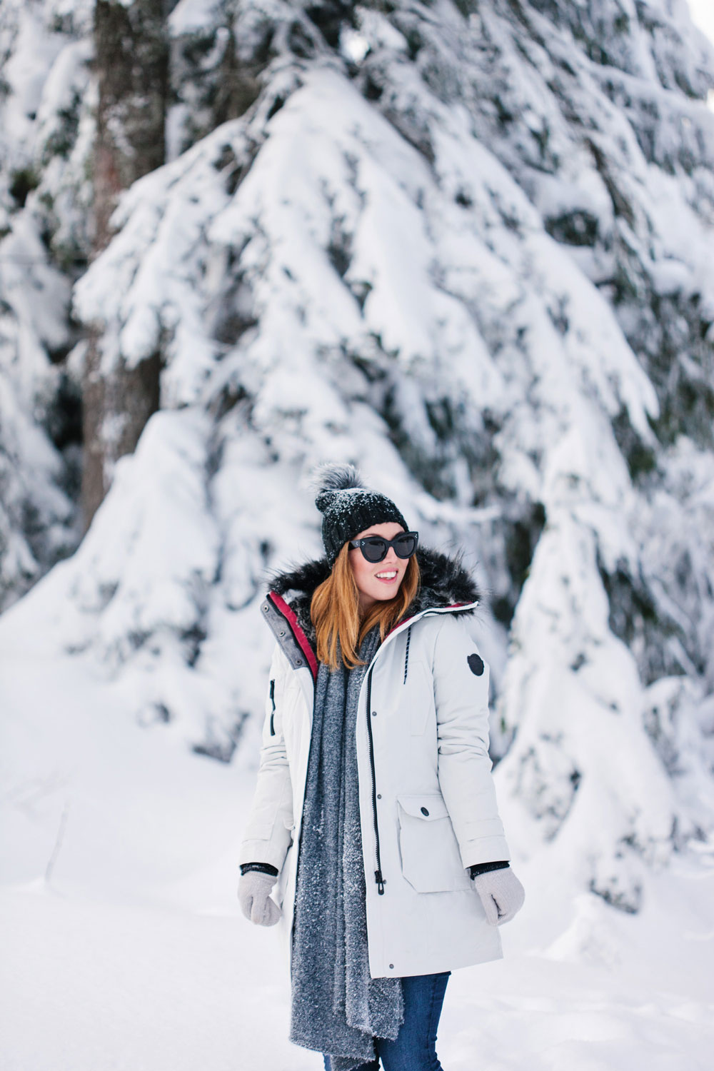 What to wear in the snow in Vancouver, with Noize parka, Express pom pom beanie, Sorel boots, White and Warren cashmere travel wrap and Aritzia mittens styled by To Vogue or Bust