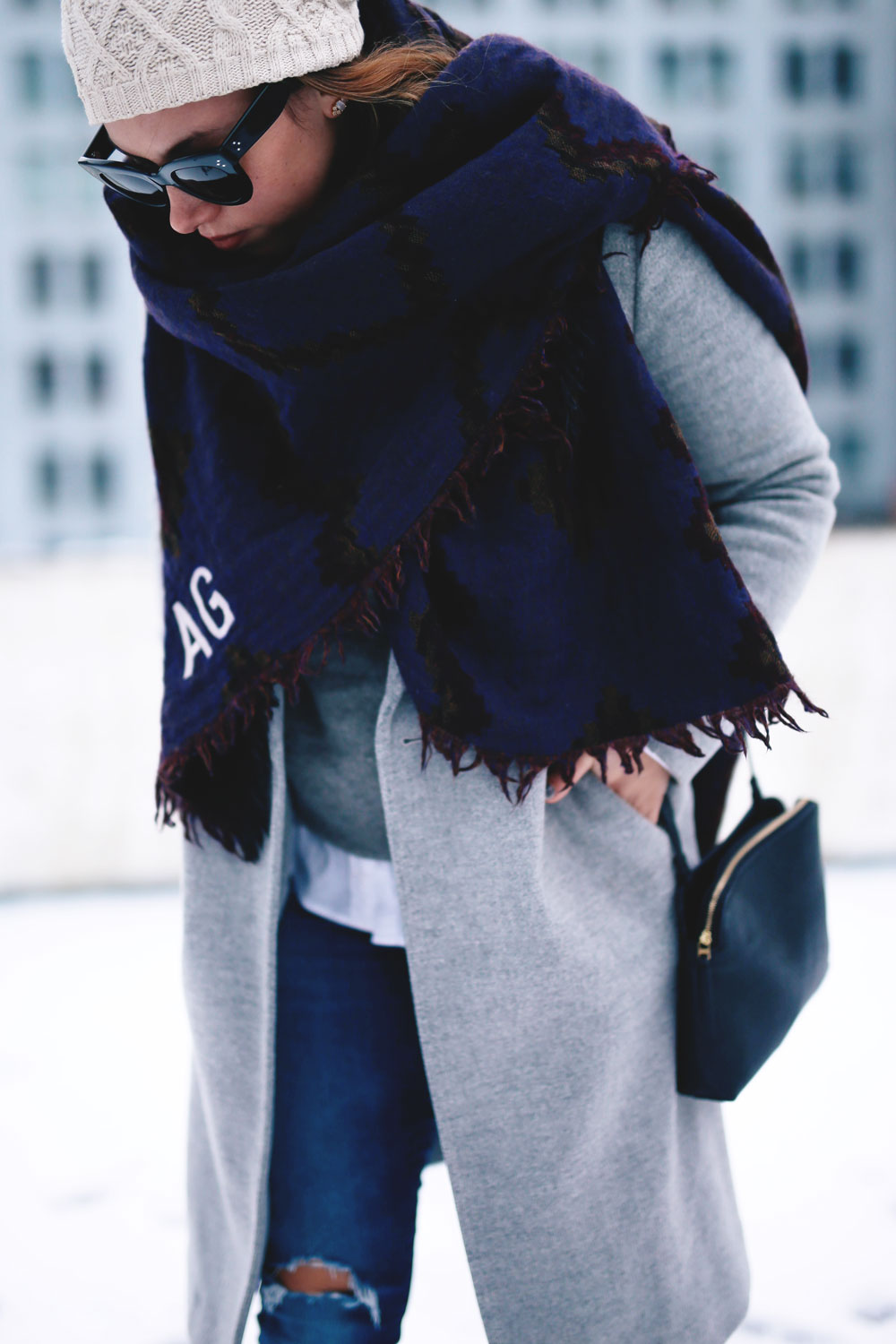 Cute outfit ideas in the snow - Aritzia blanket scarf, Aritzia grey wool coat, Tilley beanie, Mavi skinny jeans, Urban Outfitters ankle boots, Celine Caty sunglasses, layered oxford shirt