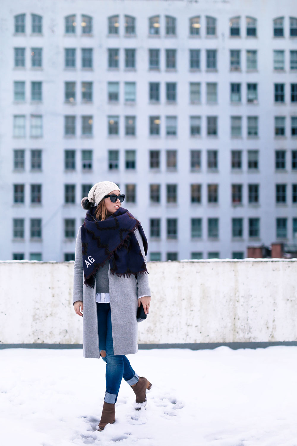 Cute outfit ideas in the snow - Aritzia blanket scarf, Aritzia grey wool coat, Tilley beanie, Mavi skinny jeans, Urban Outfitters ankle boots, Celine Caty sunglasses, layered oxford shirt