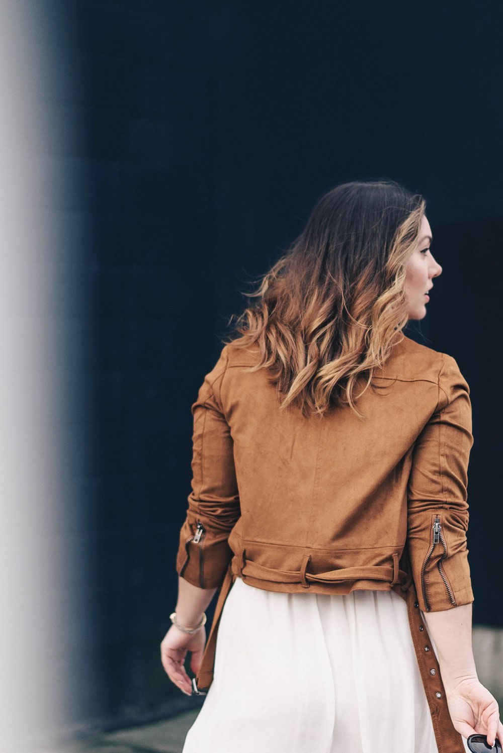 Western trend style tips in Lovers + Friends suede jacket, Revolve clothing, Aritzia skirt, Chicwish cropped top, Raye heels, Bega bag, Leah Alexandra jewelry, Celine sunglasses styled by To Vogue or Bust