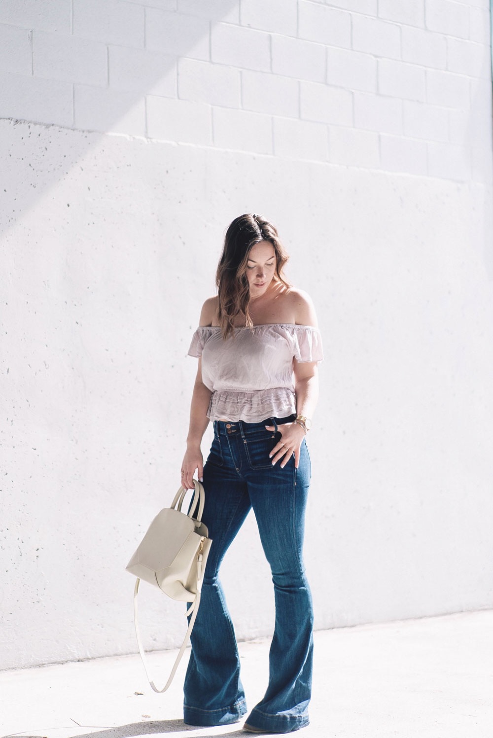 How to wear ruffles, Spring 2017 fashion trends, how to wear off the shoulder tops, Aritzia top, Express flare jeans, how to wear flare jeans by To Vogue or Bust