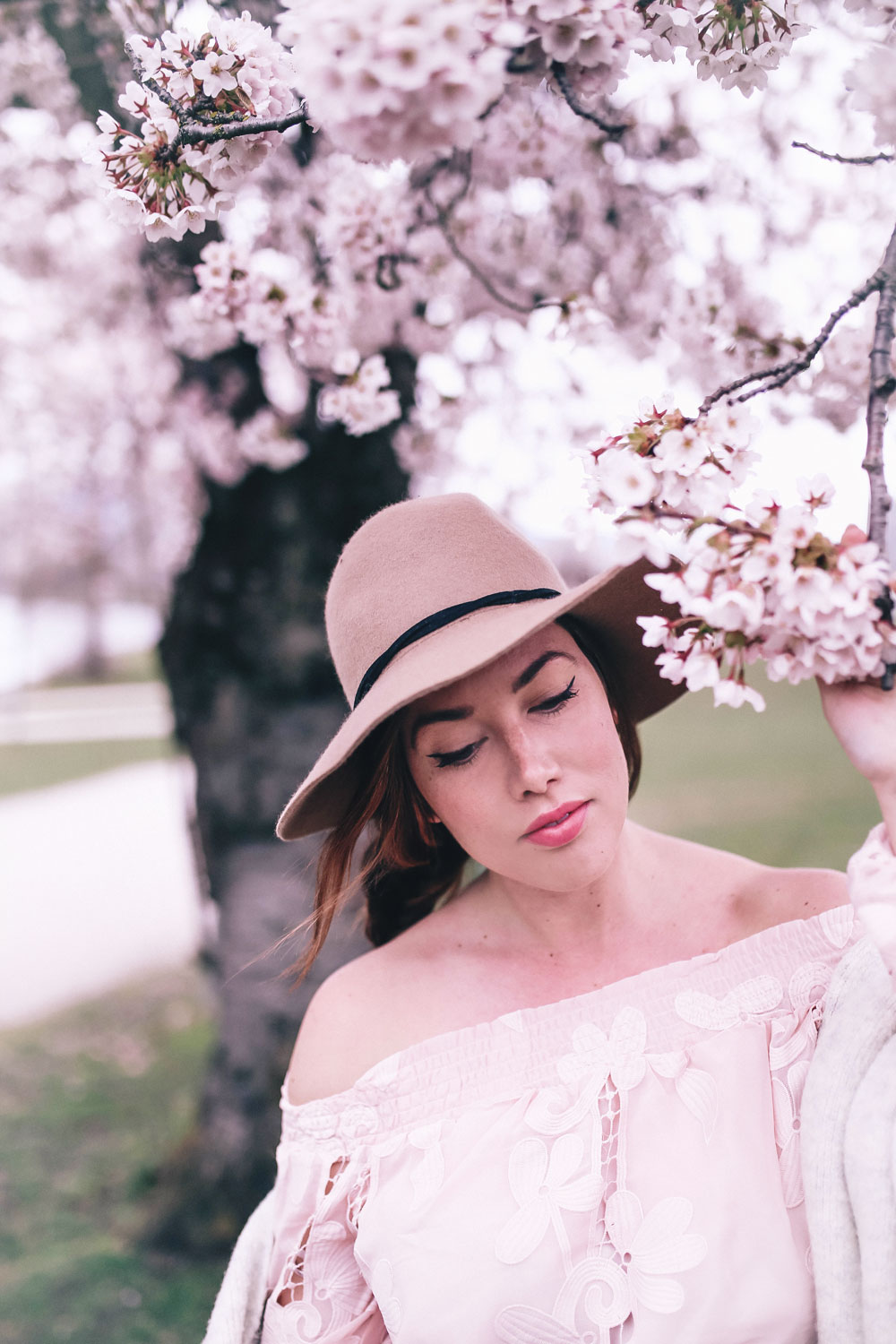 How to style off the shoulder spring trend in Revolve dress, Express wool fedora, Leah Alexandra jewellery, Revolve strapless dress, Mavi Coatigan, Lovers and Friends dress, how to wear strapless, cherry blossoms in Vancouver by To Vogue or Bust 