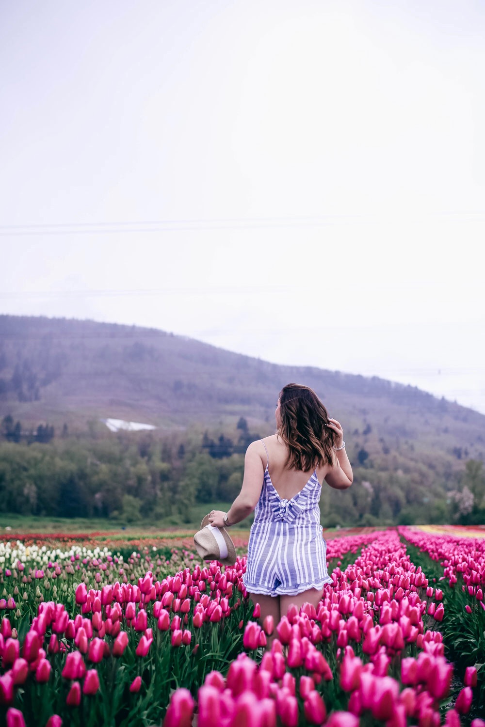 How to transition into summer style, how to wear a romper, how to wear a denim jacket, romper spring style, in aritzia straw hat, cluse watch, lovers friends romper, revolve romper, at abbotsford tulip festival by To Vogue or Bust 