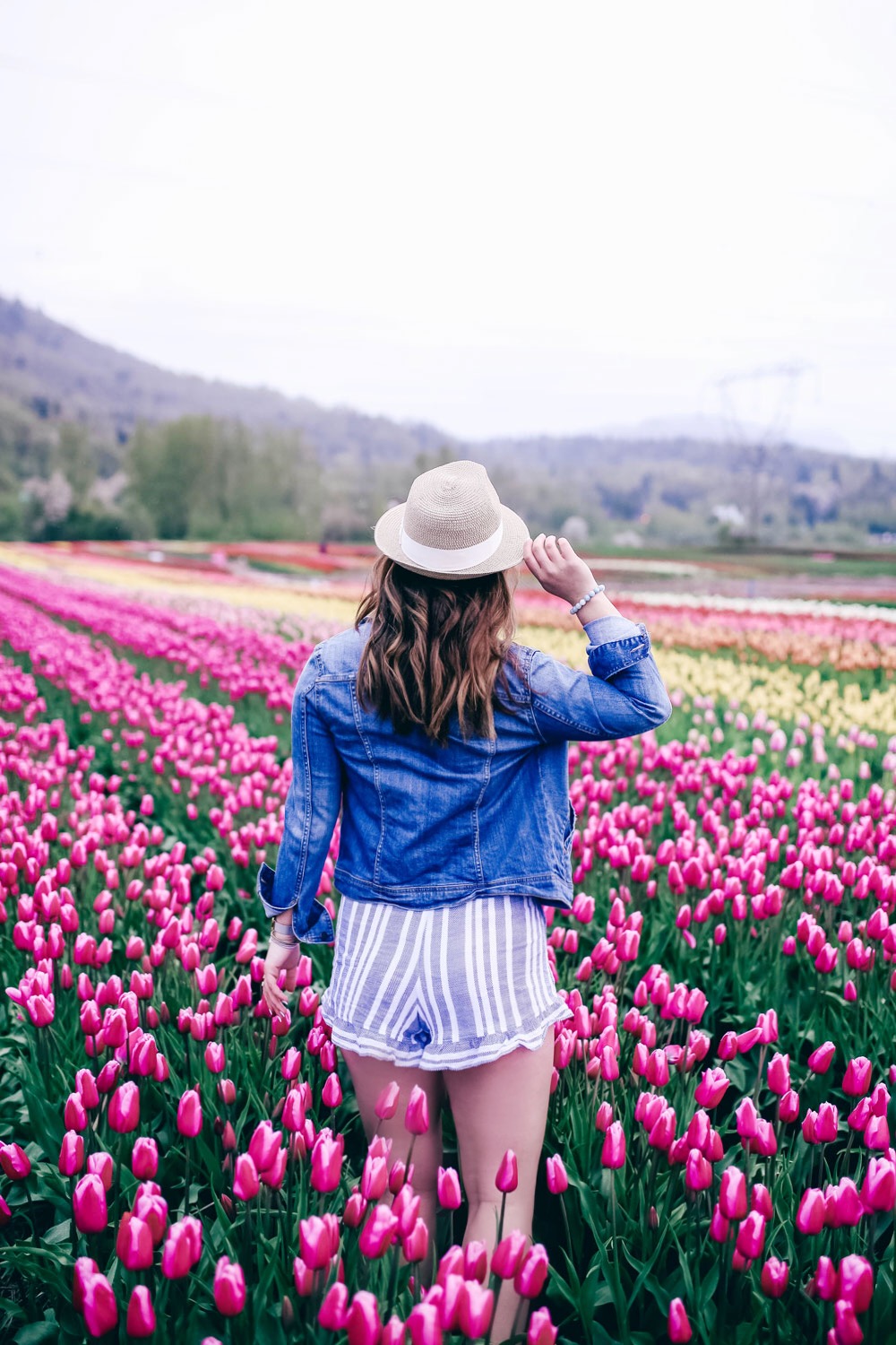 How to transition into summer style, how to wear a romper, how to wear a denim jacket, romper spring style, in aritzia straw hat, cluse watch, lovers friends romper, revolve romper, at abbotsford tulip festival by To Vogue or Bust 