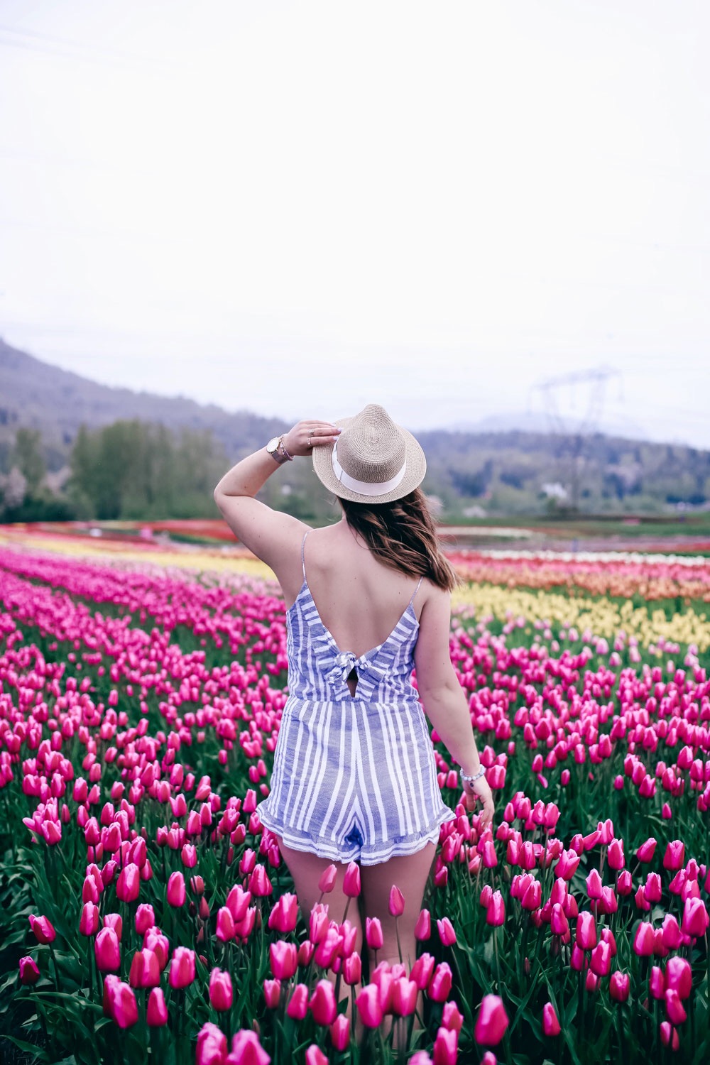 How to transition into summer style, how to wear a romper, how to wear a denim jacket, romper spring style, in aritzia straw hat, cluse watch, lovers friends romper, revolve romper, at abbotsford tulip festival by To Vogue or Bust 