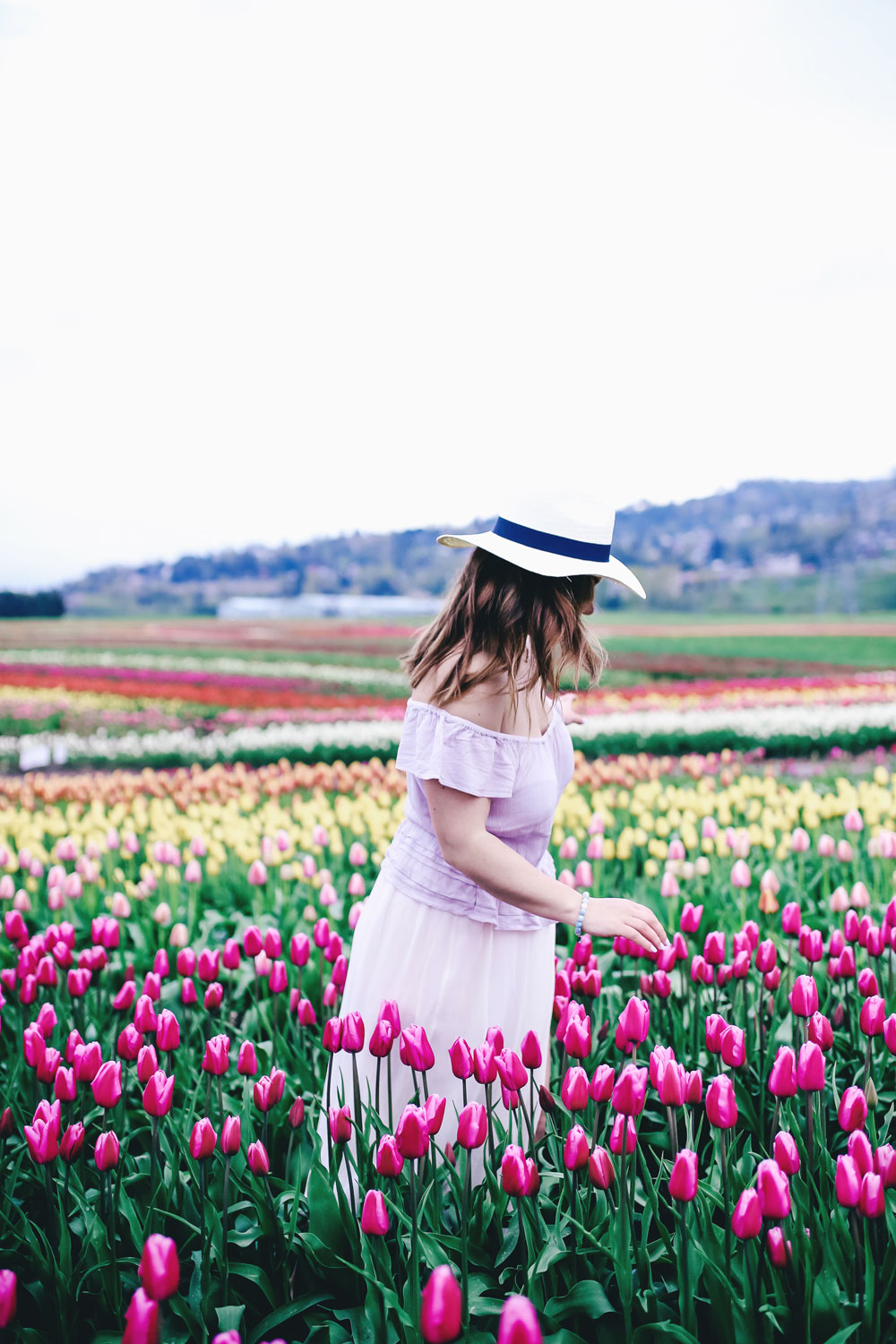 Tulip fields in Vancouver by To Vogue or Bust in an Aritzia silk skirt Aritzia off the shoulder top Joe Fresh panama hat