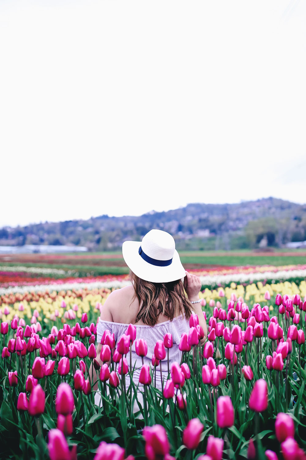 Tulip fields in Vancouver by To Vogue or Bust in an Aritzia silk skirt Aritzia off the shoulder top Joe Fresh panama hat