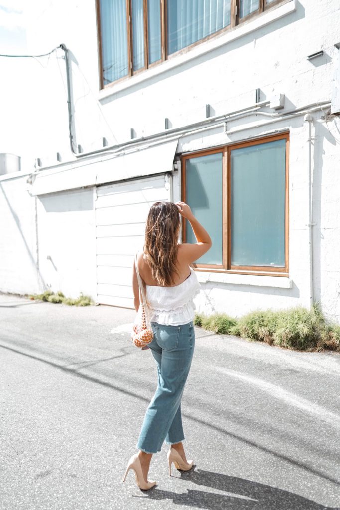 Perfect easy summer-ready cropped jeans outfit idea in Mavi Romee cropped jeans paired with a white crop top and nude Ted Baker pumps, styled by To Vogue or Bust.