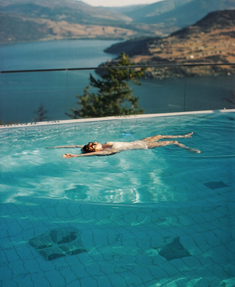 Woman floating in the pool at Sparkling Hill Resort