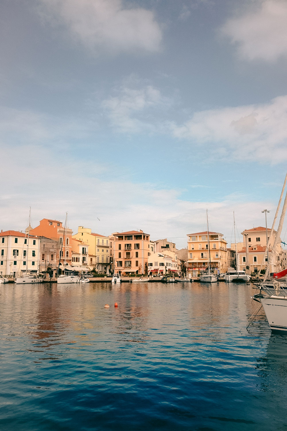 Harbor and pastel buildings in La Maddalena town, Sardinia