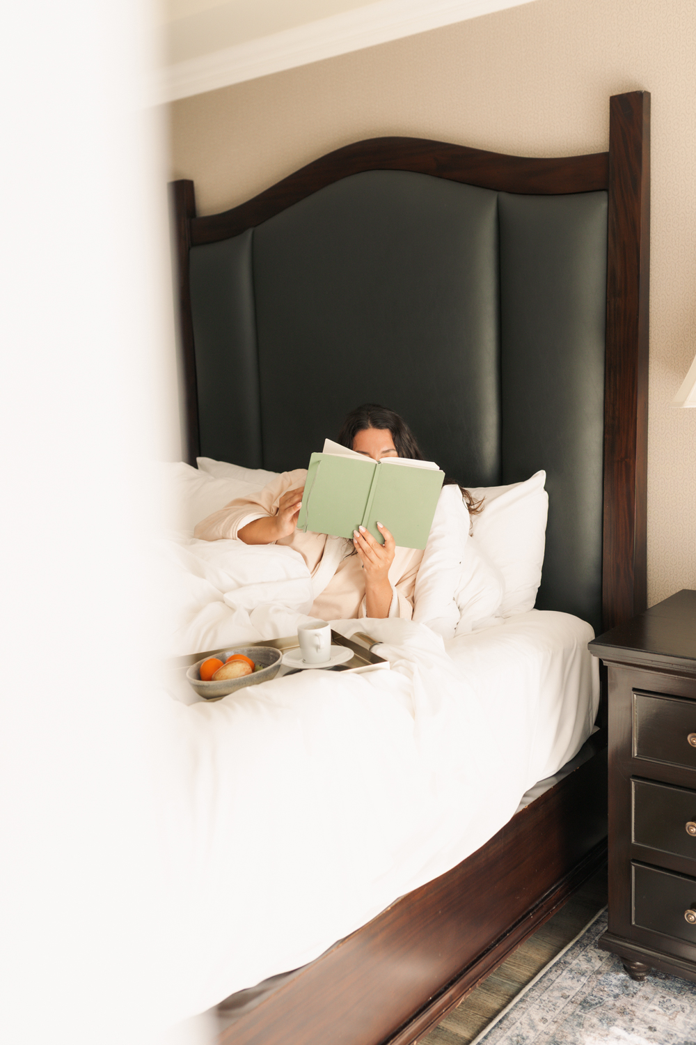 Guest room and bed at Oak Bay Beach Hotel in Victoria