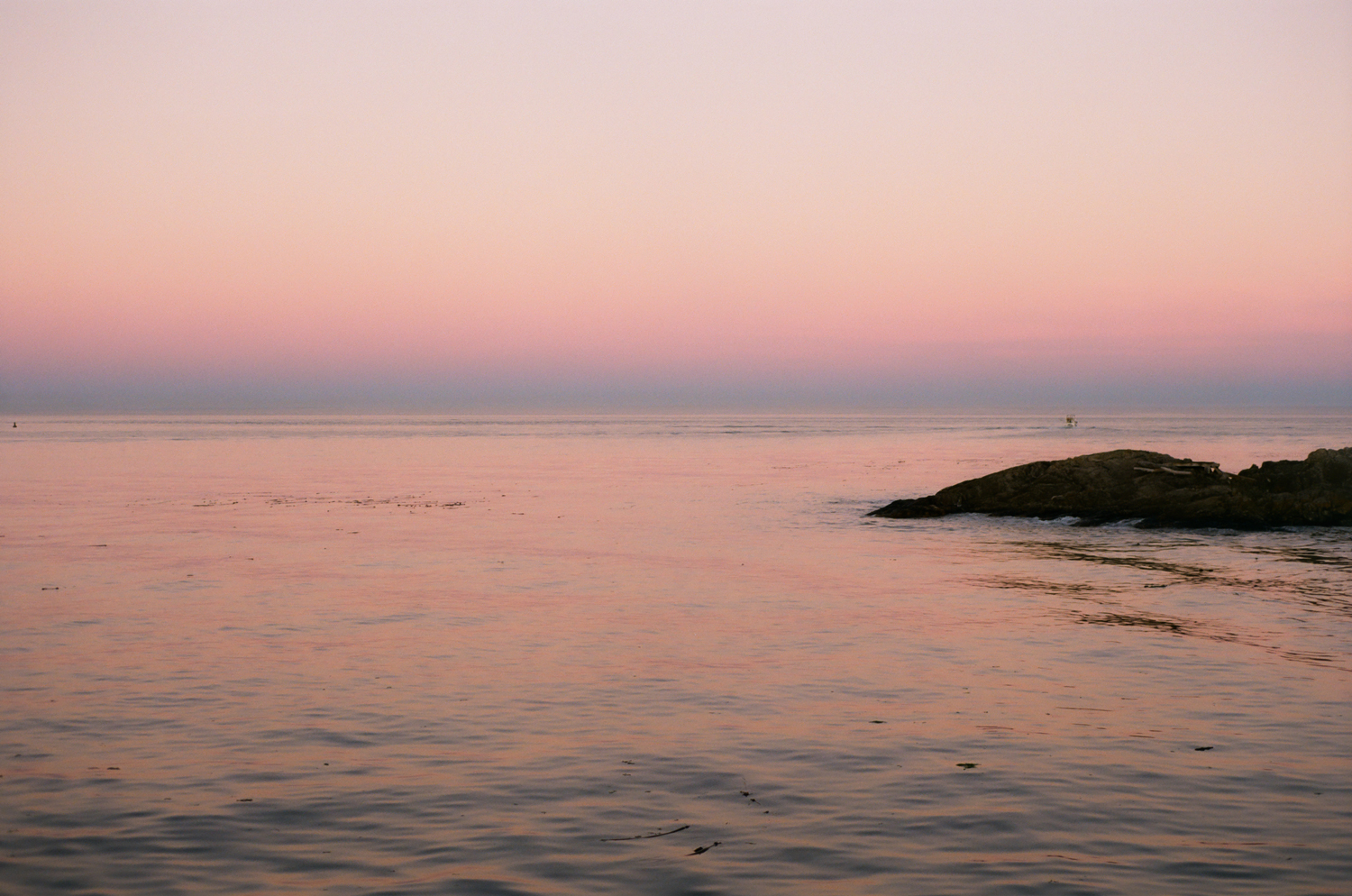 Pink sunset over the Salish Sea during a Victoria weekend getaway