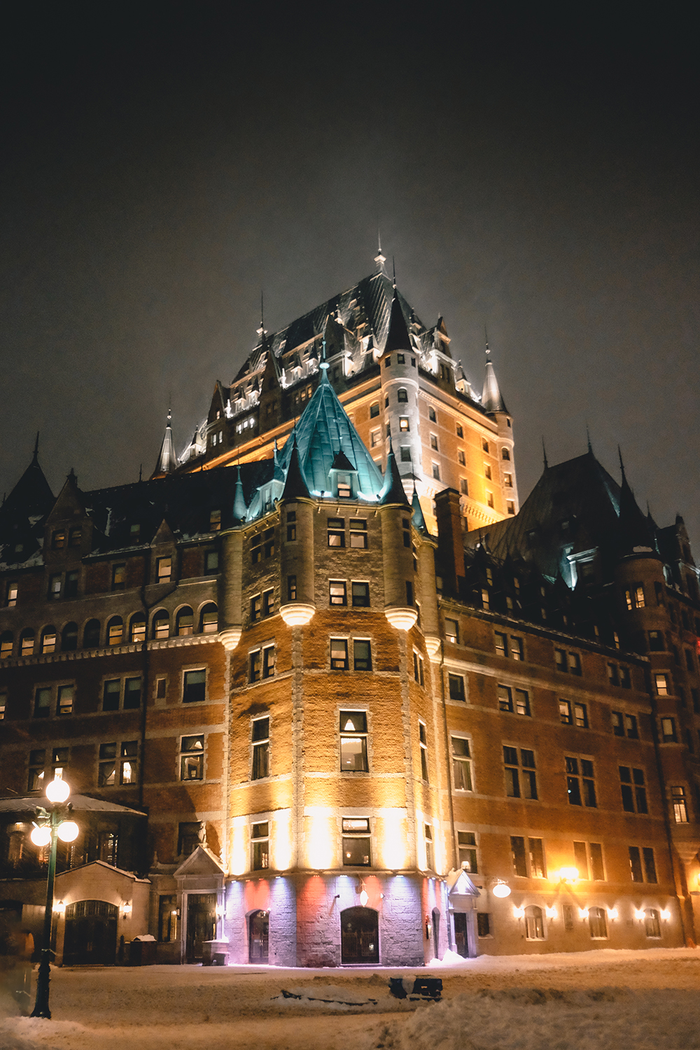 Château Frontenac illuminated at night in winter