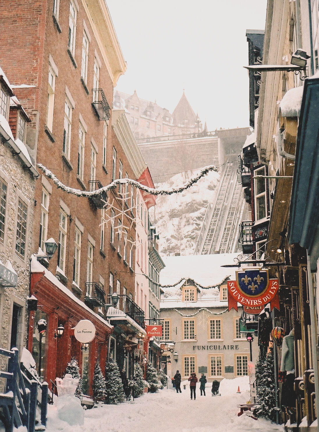 Narrow snow-covered street in Old Québec City in winter
