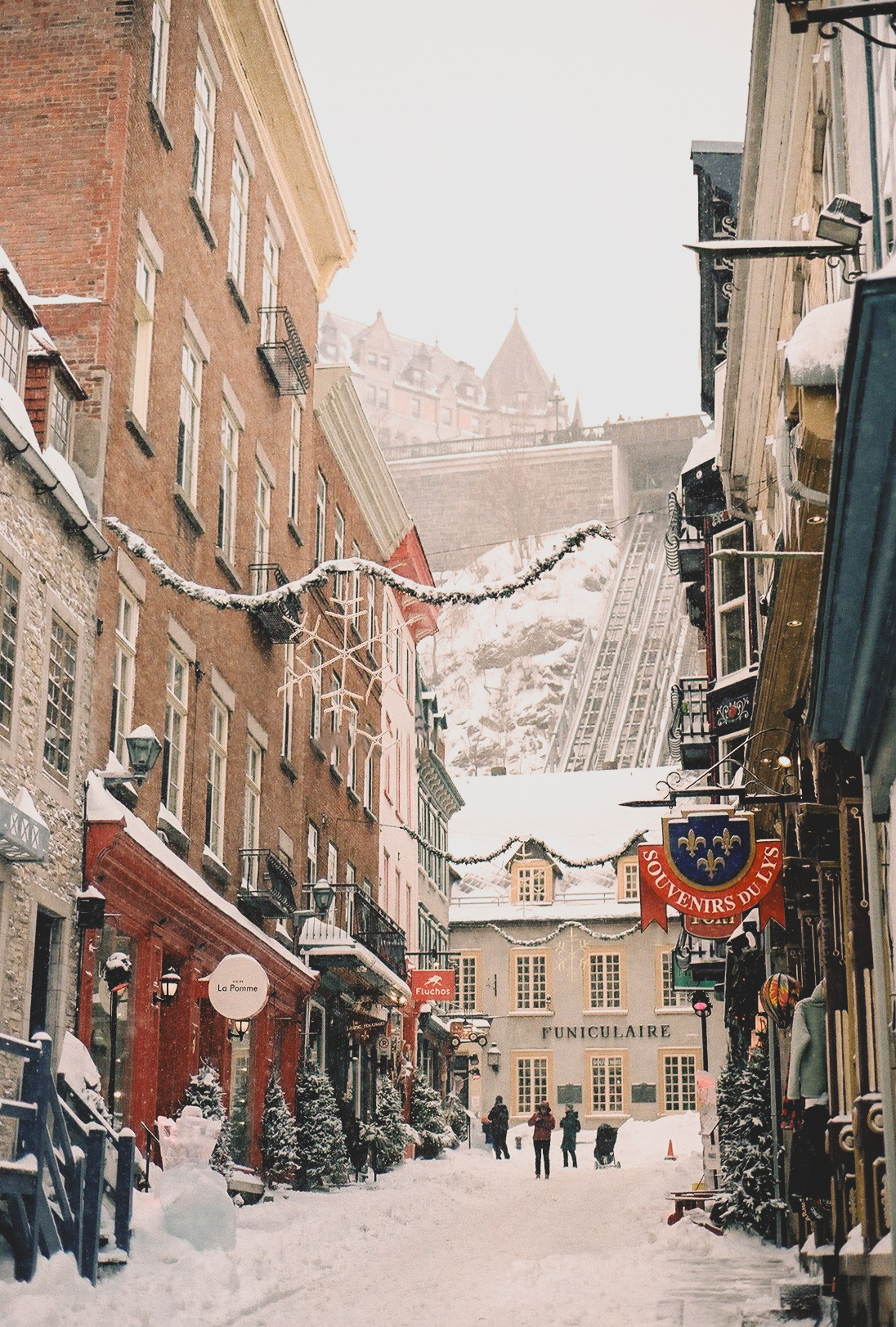 Narrow snow-covered street in Old Québec City in winter