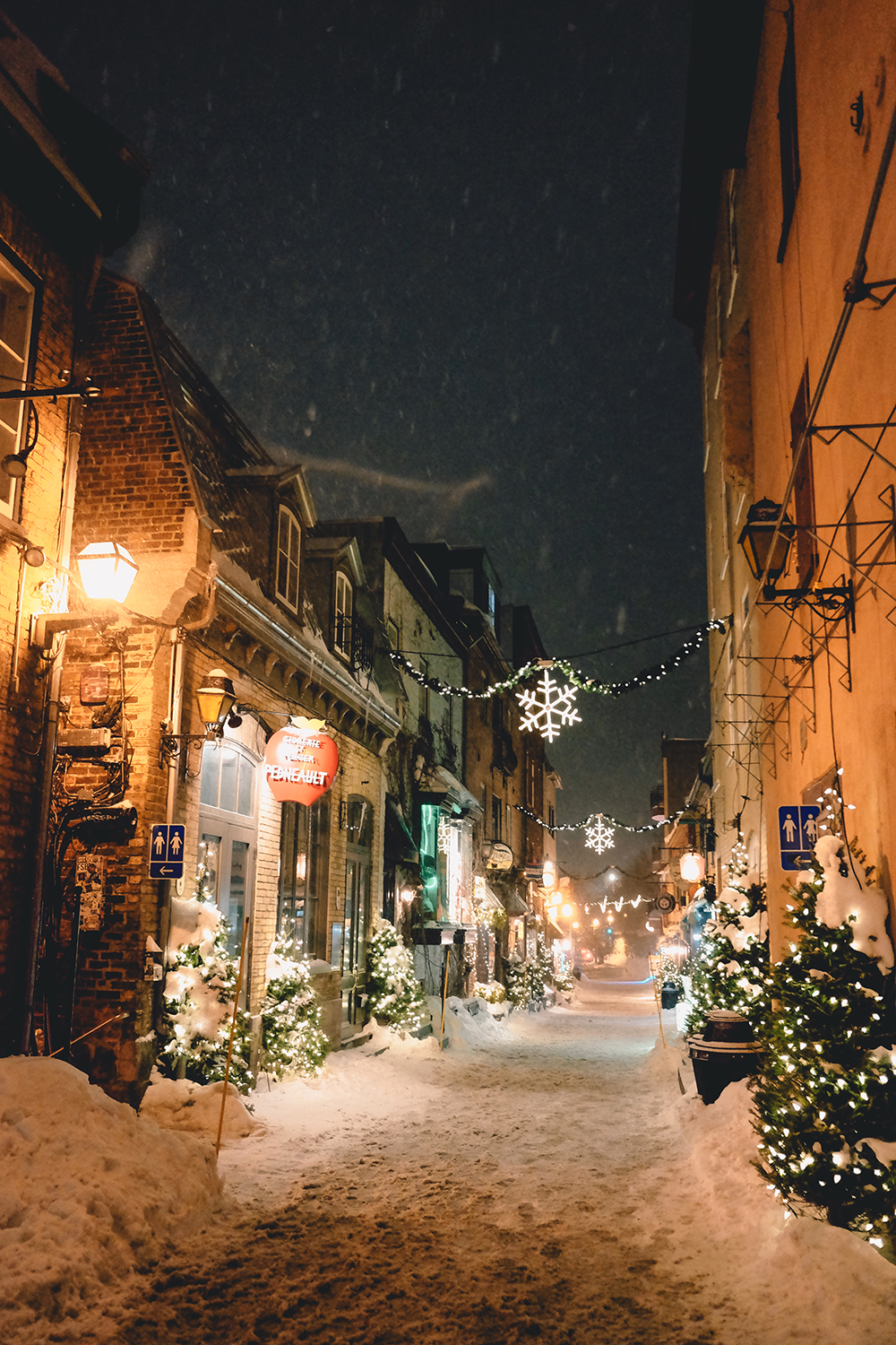 Petit-Champlain street glowing with lights on a snowy winter night