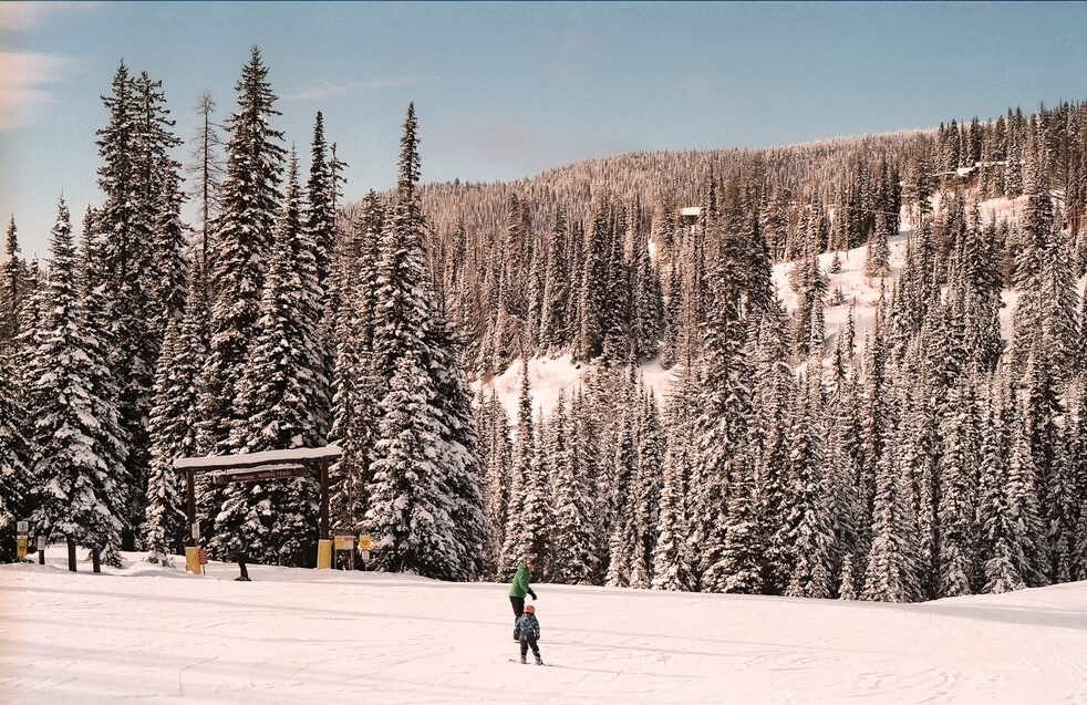 Skier crossing a snowy slope at SilverStar Mountain Resort