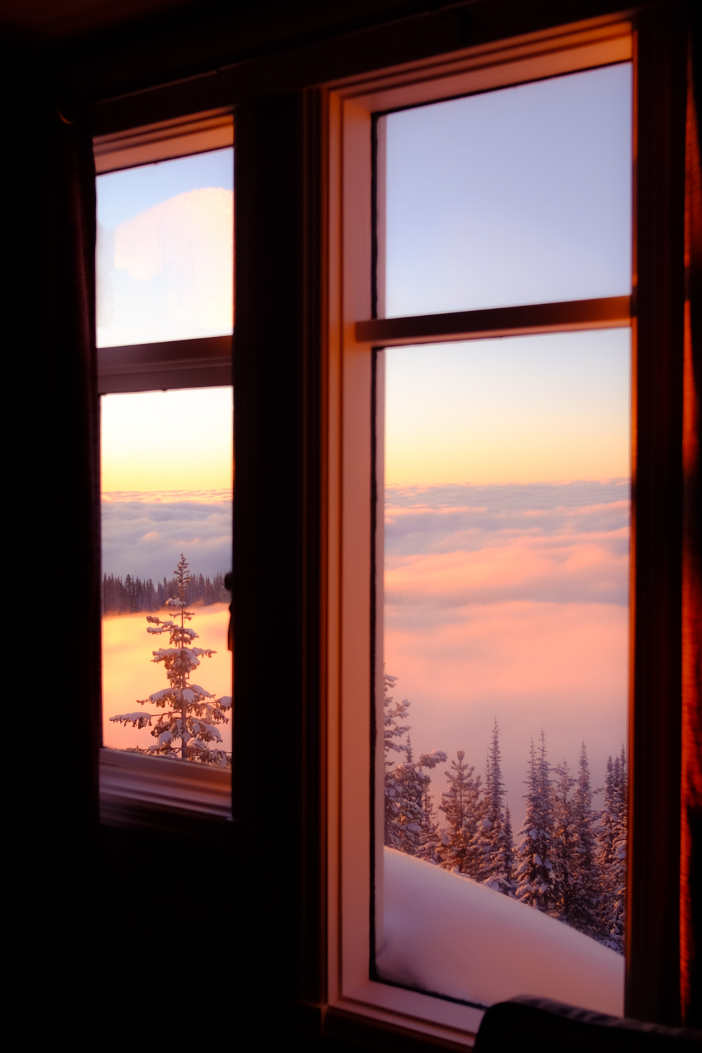 Sunrise mountain view through a window at Bookend Mountain Retreat
