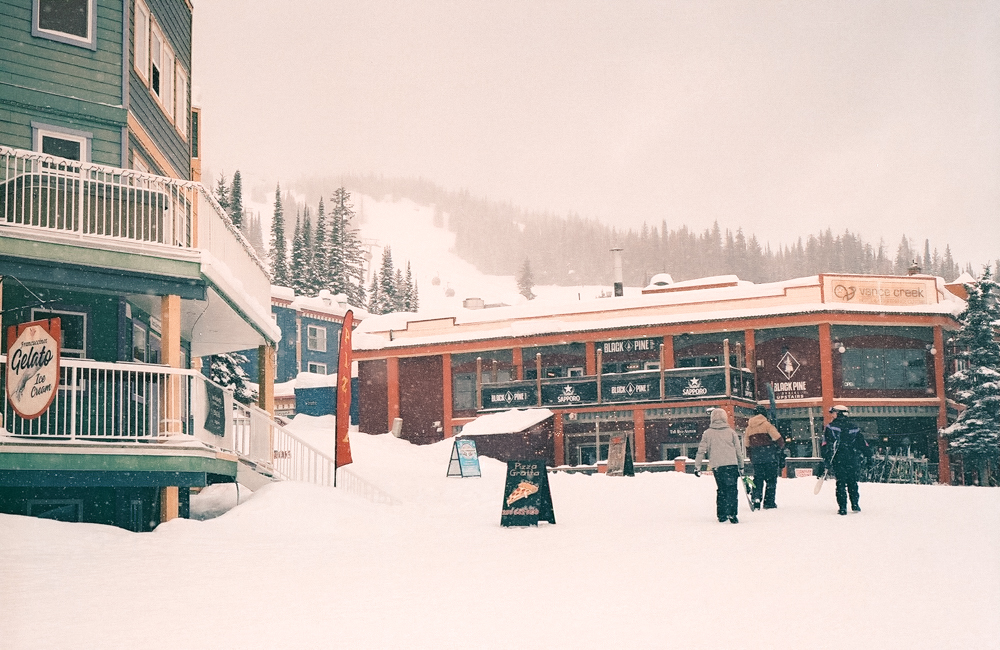 Colourful SilverStar Mountain Resort village covered in snow