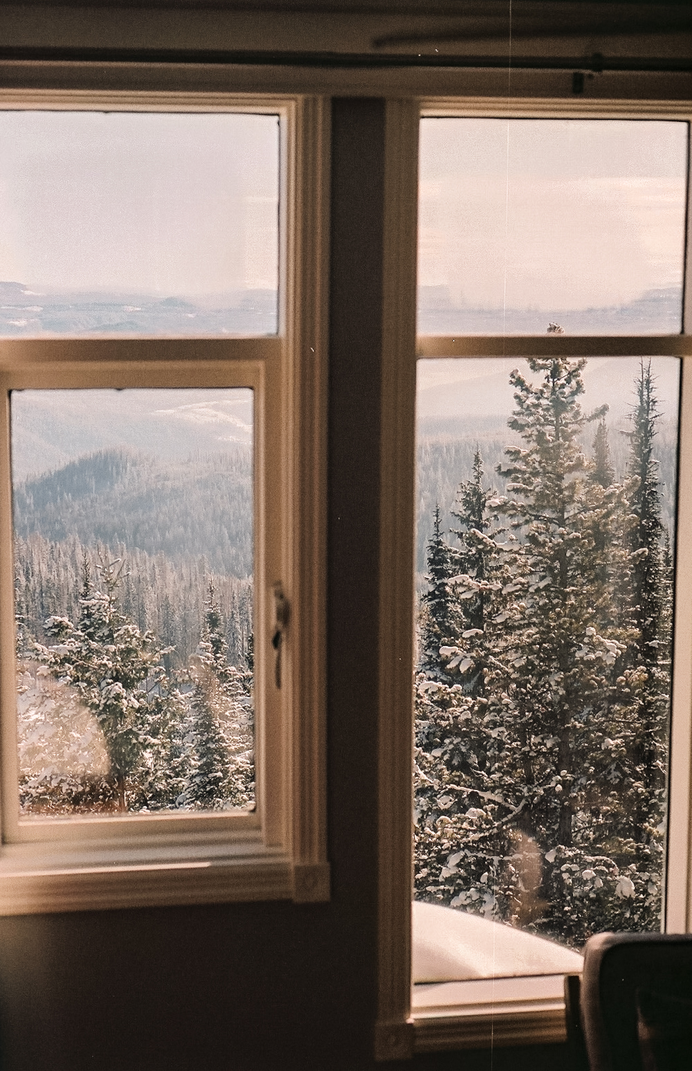 Snowy mountain view through the windows at Bookend Mountain Retreat