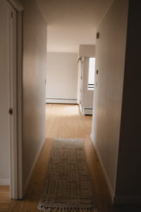 Hallway before professional painting in a Vancouver home