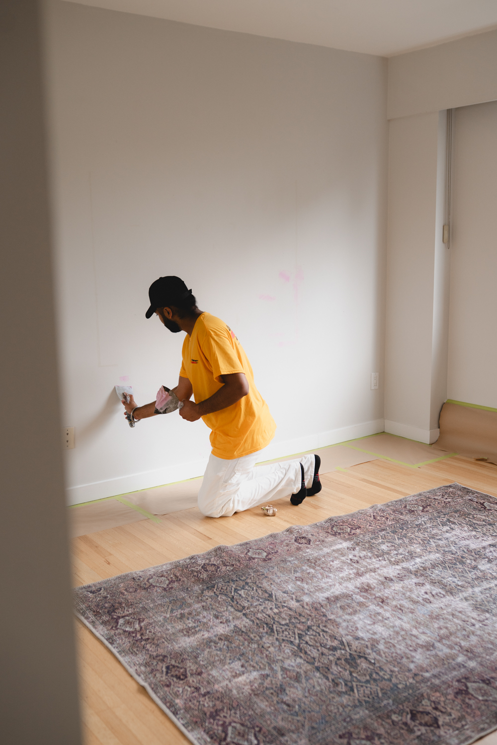 Professional painter preparing an interior room for painting in Vancouver