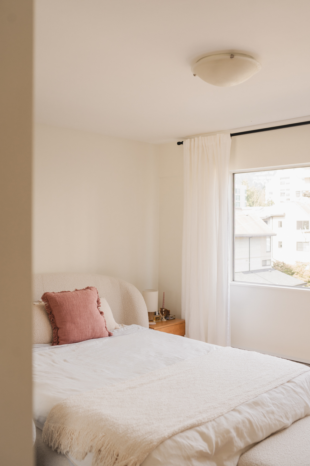 Bright bedroom with freshly painted walls after a Vancouver interior painting project